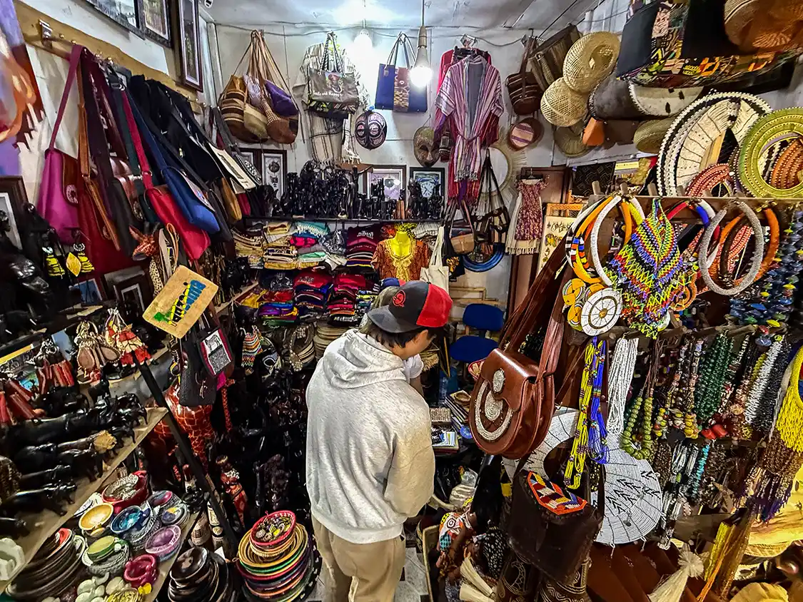 Teenager shops at the Maasai Market in Arusha Tanzania