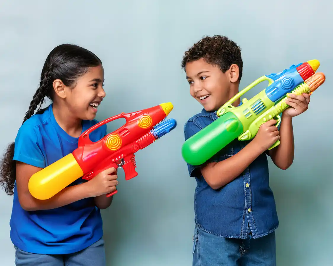 Two children playing with waterguns