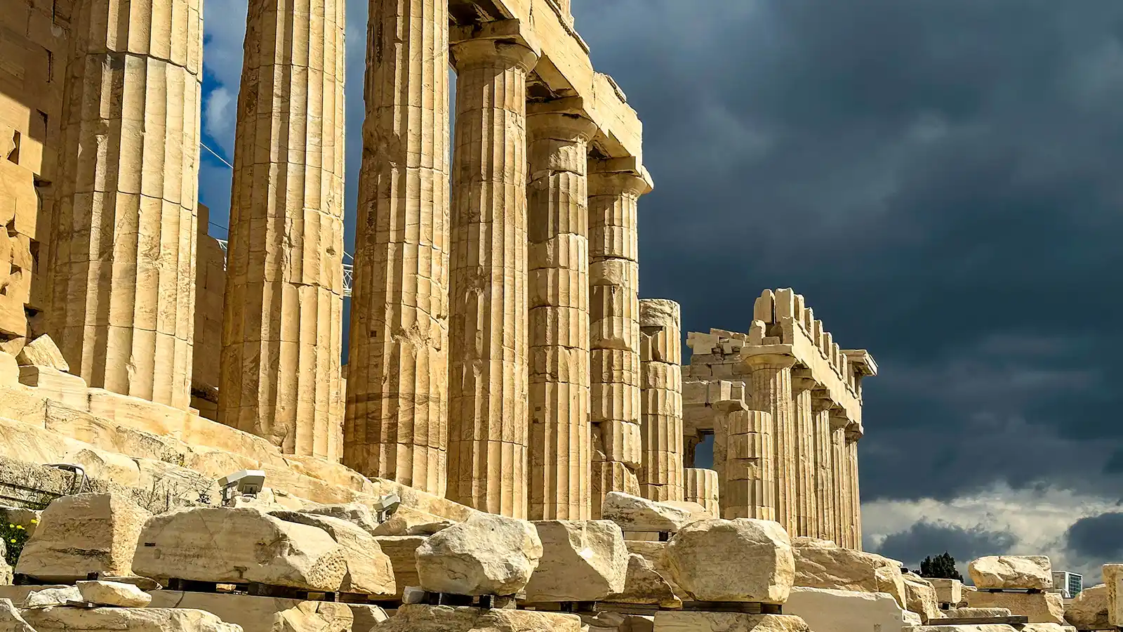 The ruins of the Parthenon against a stormy sky