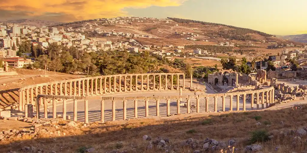 The ruins of Jerash in Northwest Jordan under a sunset sky
