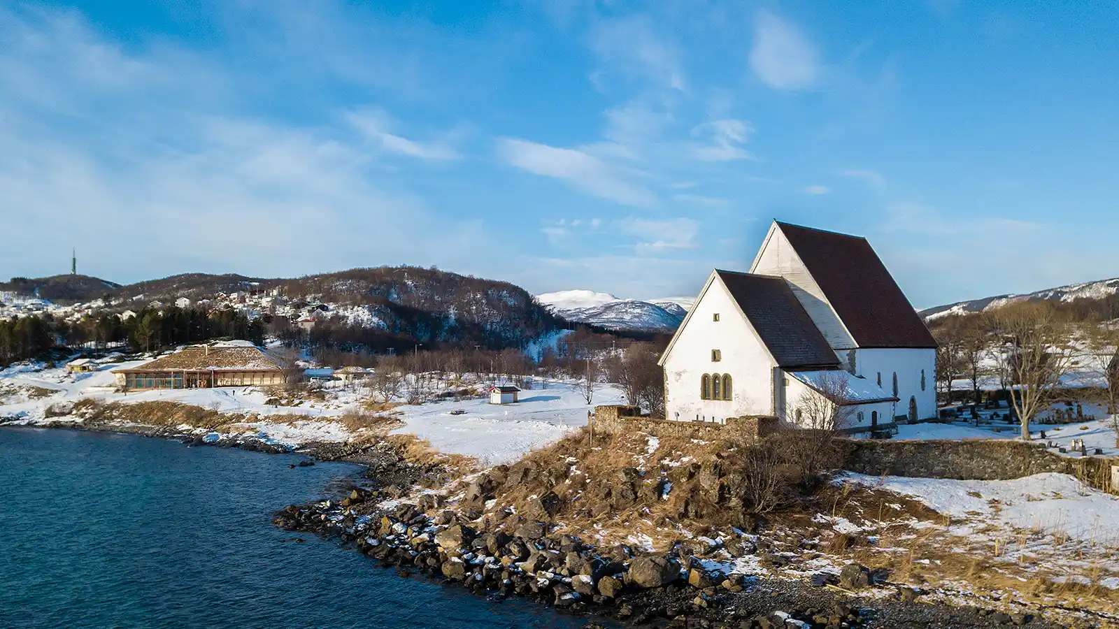 A church in remote Norway overlooking the coast on a family travel guide