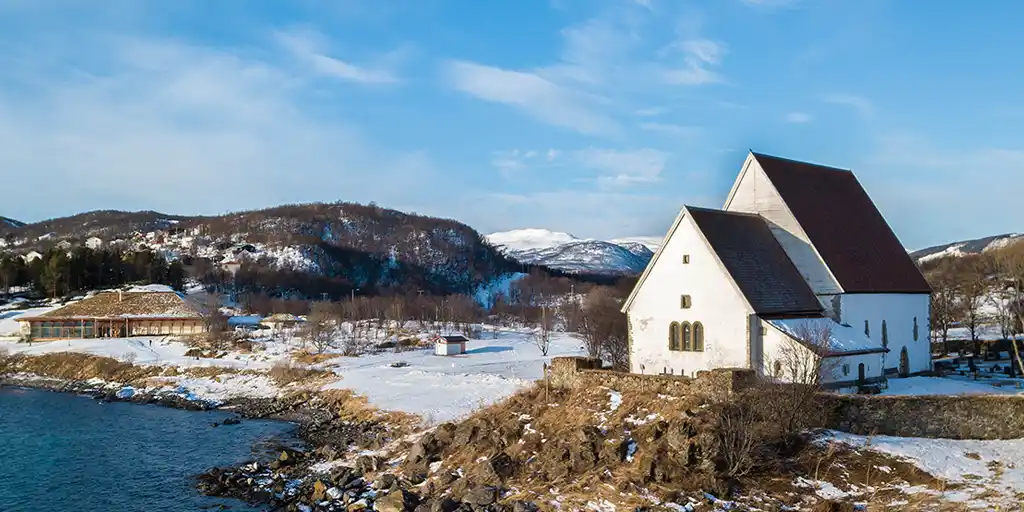 A church in remote Norway overlooking the coast on a family travel guide