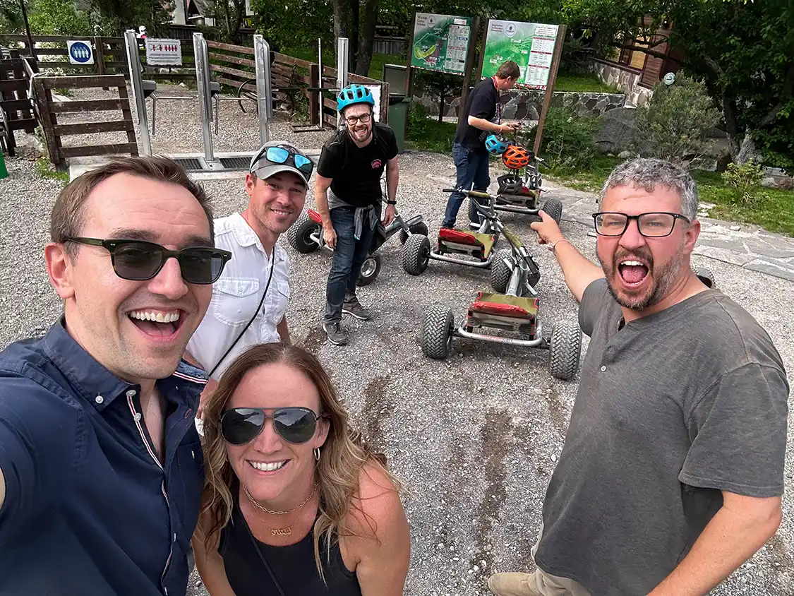 Group of travellers pointing at mountain trikes near Almaty Kazakhstan