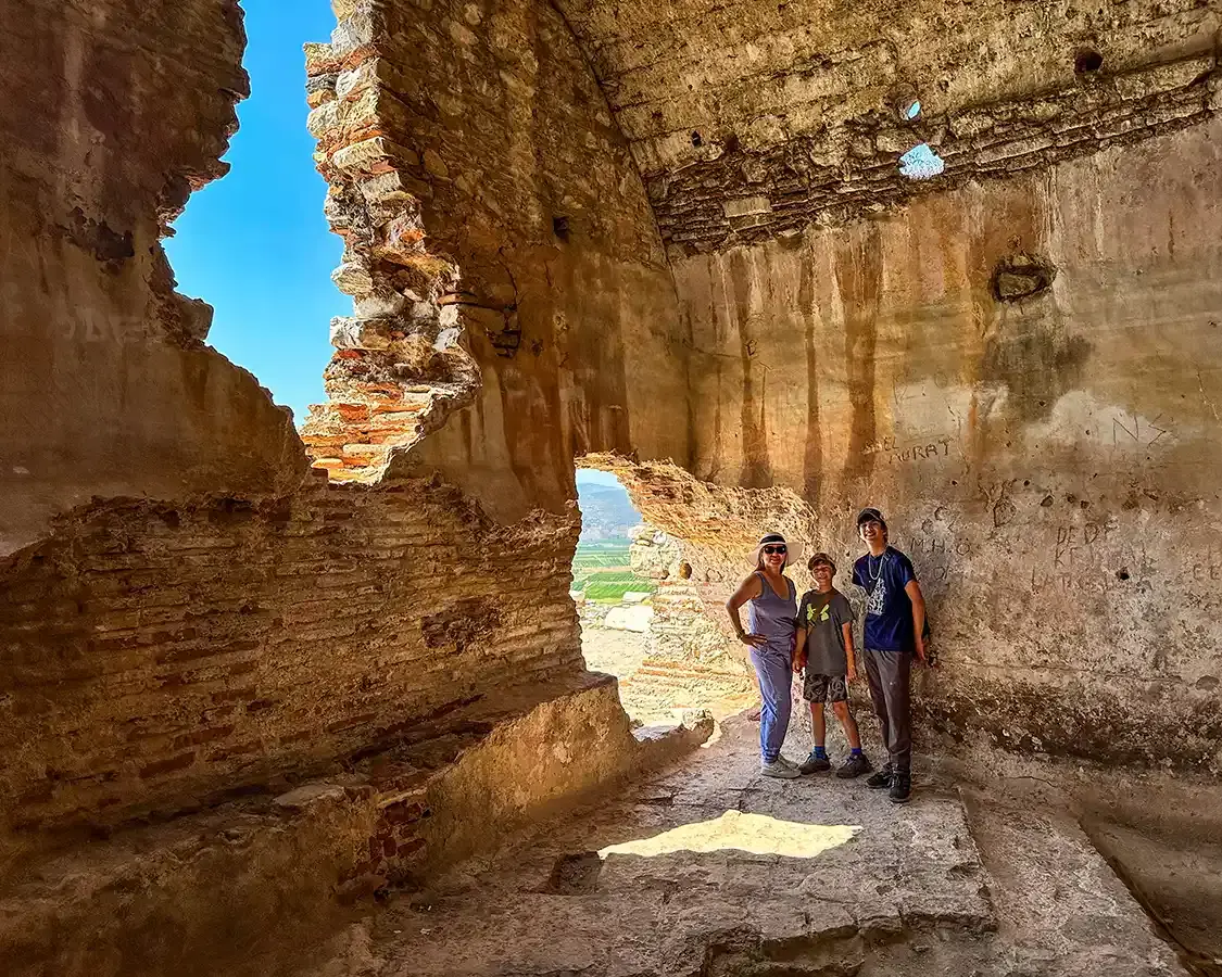 A family explores the ruins of a castle in Selcuk Turkey