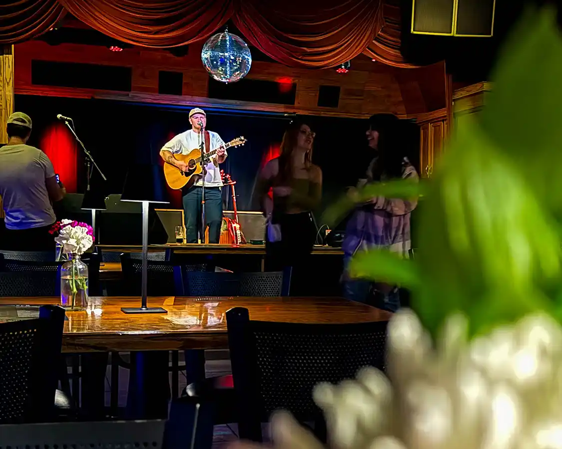 A singer performs on a stage at The Foundry Pub in Thunder Bay