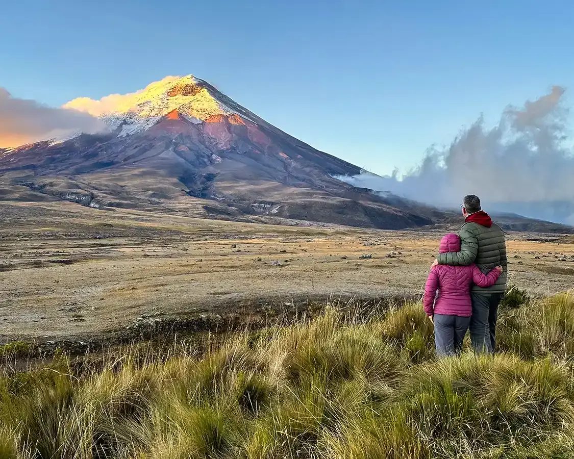 Couple wearing puffer jackets in Cotopaxi National Park Ecuador