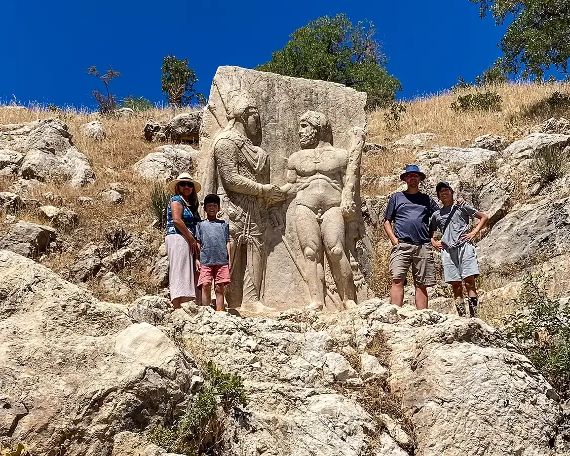 Family exploring the ruins of Arsameia Turkey
