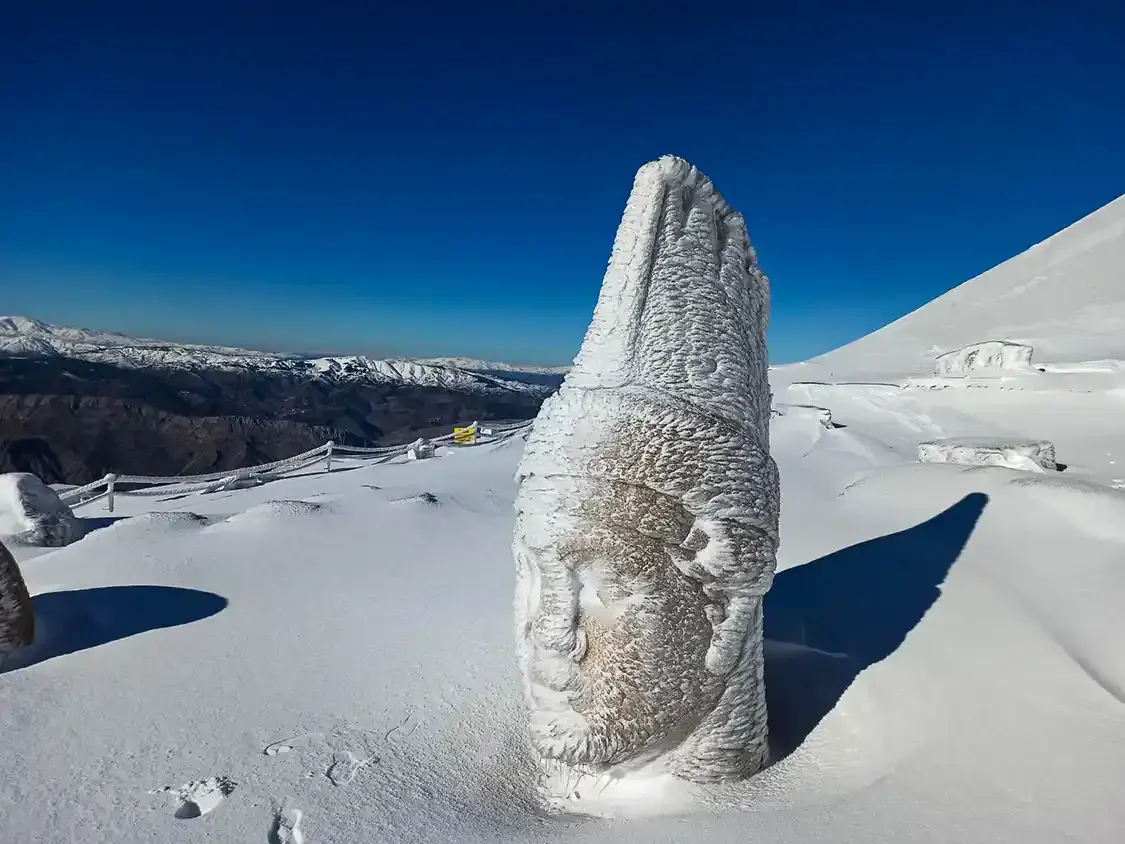 The statues at the summit of Mount Nemrut covered in snow