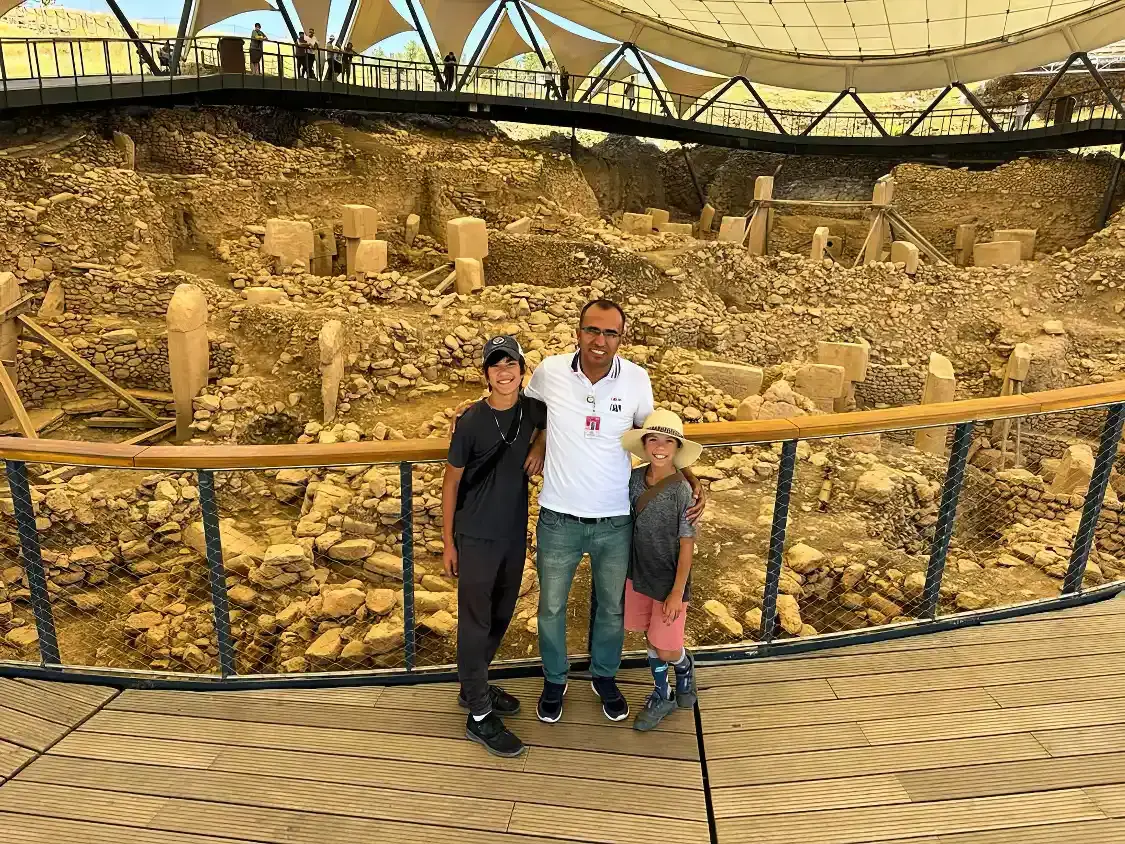 Two boys pose with their Tours by Locals guide in Gobekli Tepe Turkey
