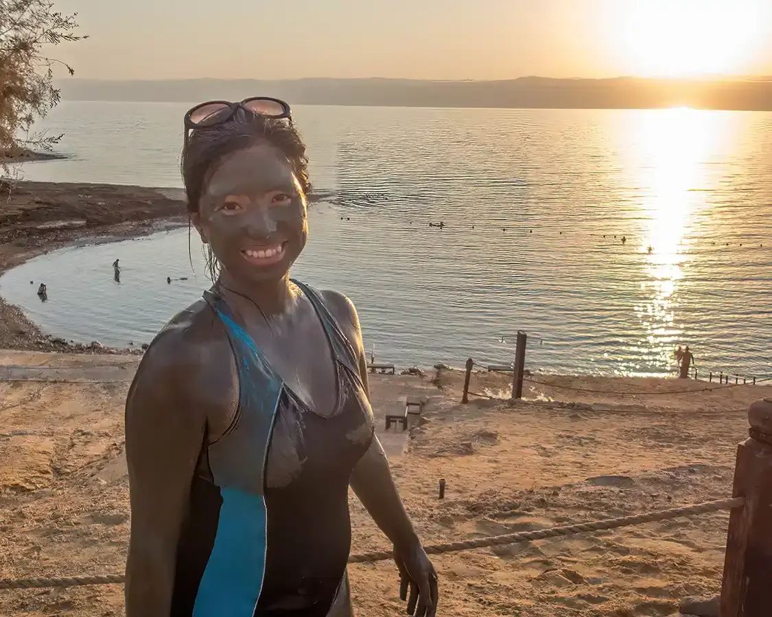 Christina Wagar covered in mud at the Dead Sea in Jordan