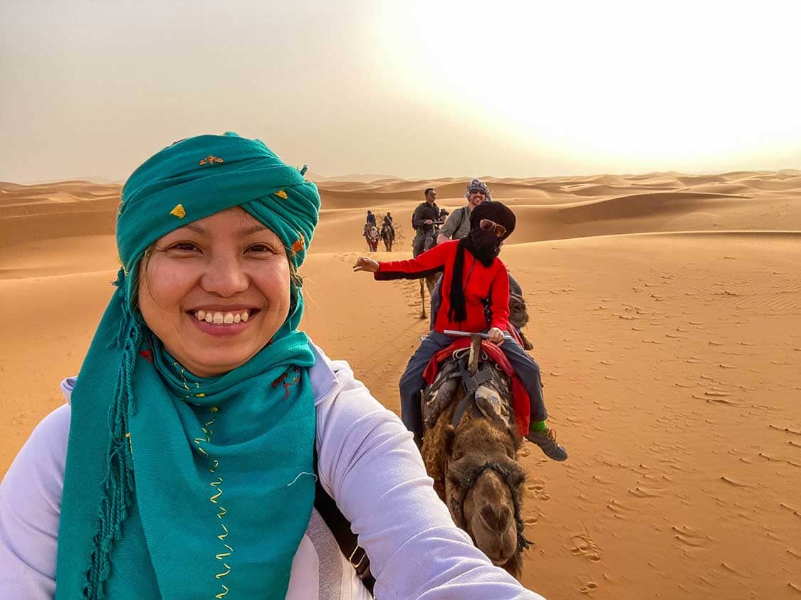 A family on a camel trek in the Sahara Desert in Morocco