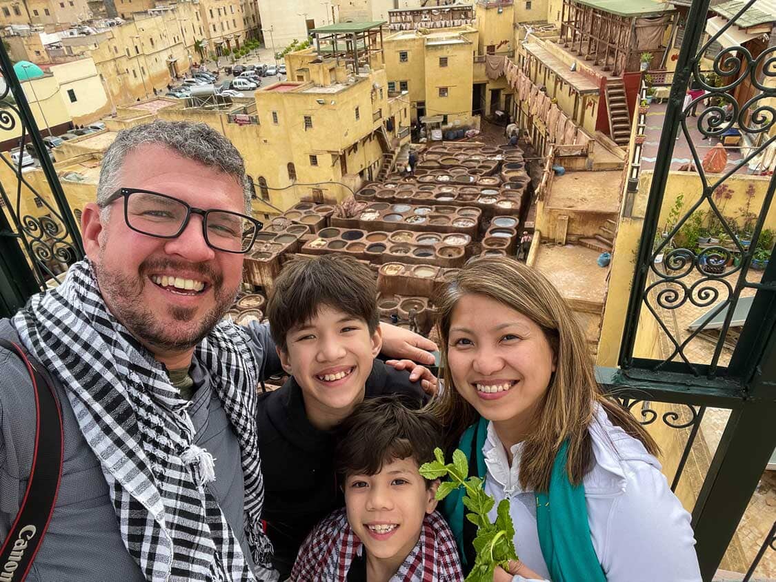A family looking out over the leather tannery in Fes, Morocco