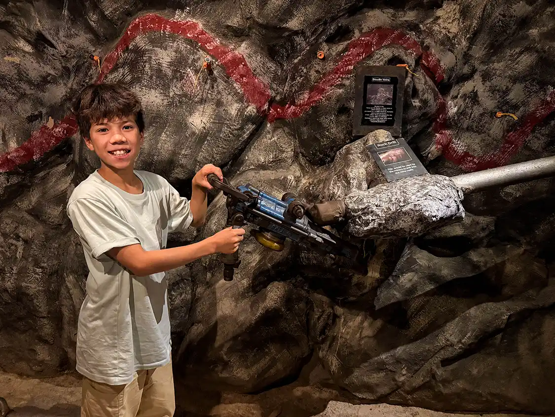 A young boy in a Tanzanite mining Tour at Tanzanite Experience Arusha