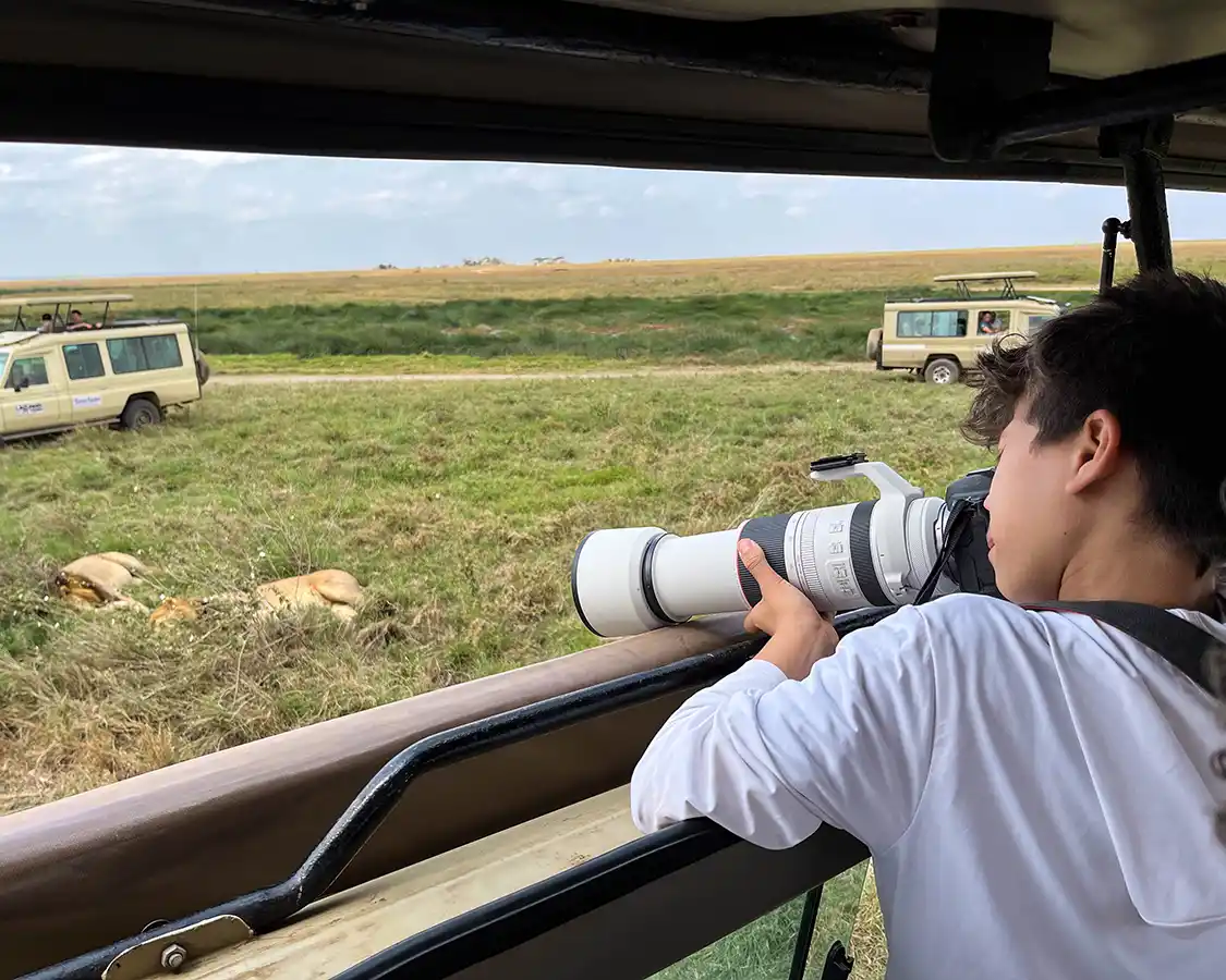 Dylan Wagar taking photos while on Safari in Serengeti National Park