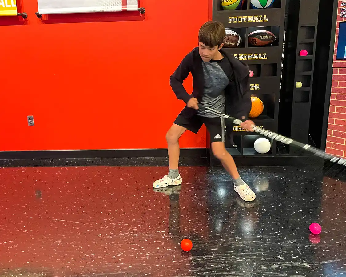 Boy playing hockey at the New Brunswick Sports Hall of Fame in Fredericton