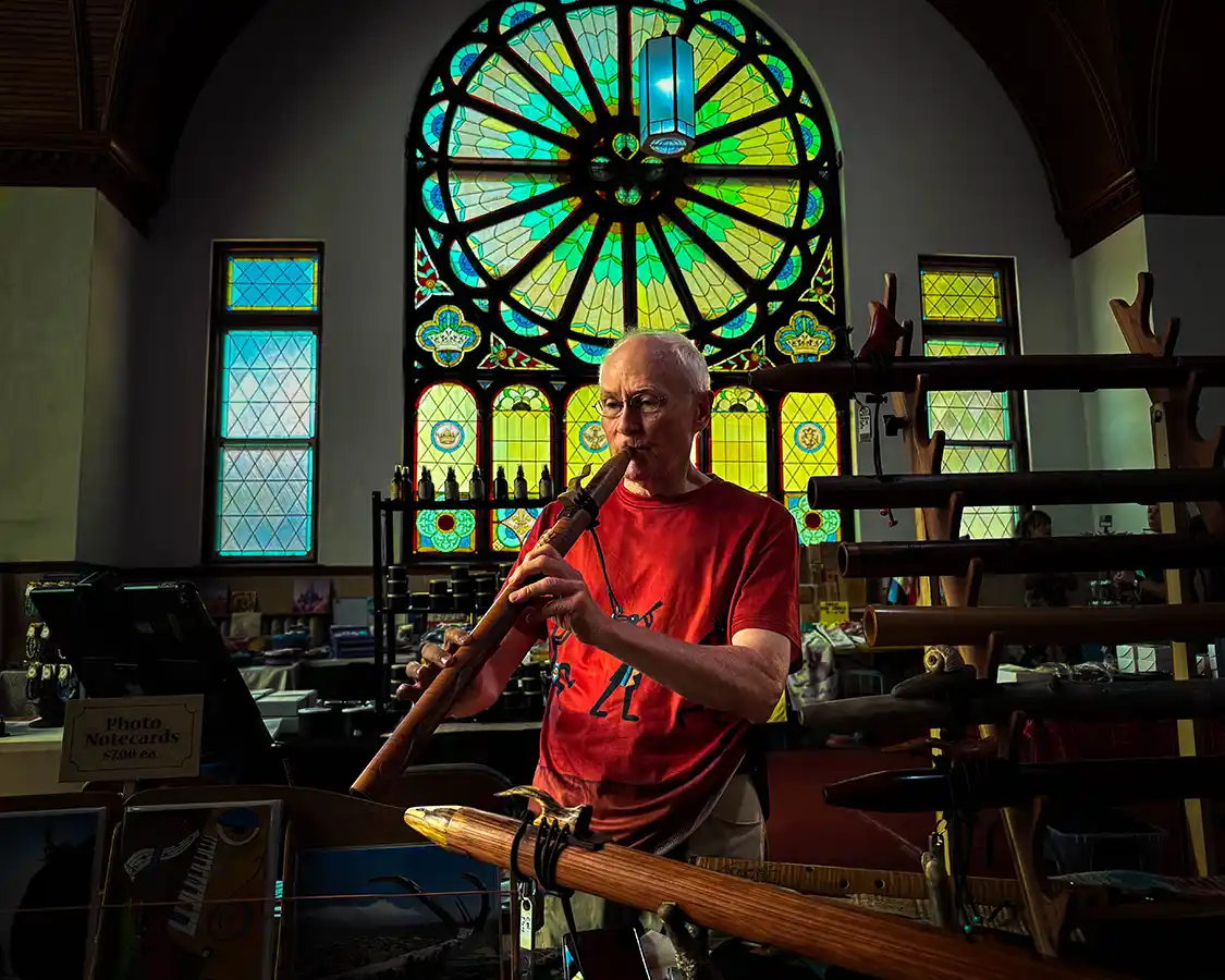 Brian Townsend plays a driftwood flute at the Hillsborough Market