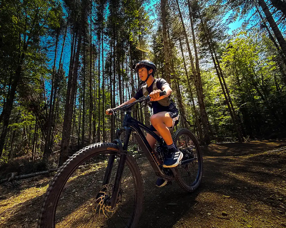 Dylan Wagar biking the Killarney Lake Mountain Biking Trails