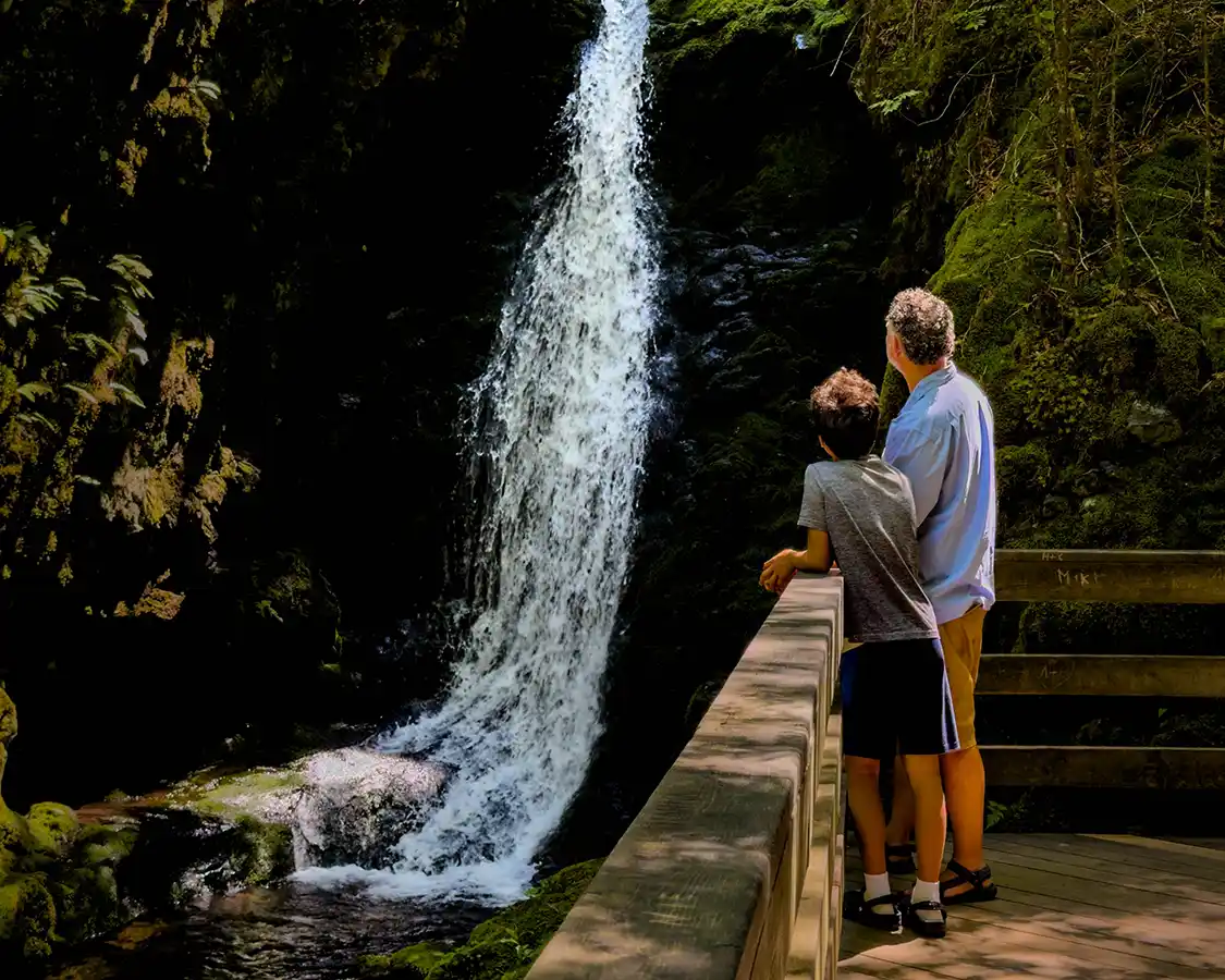 FAther and son hiking Dickson Falls at Fundy National Park