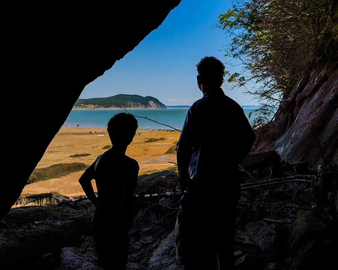 Kevin Wagar and his son Dylan exploring sea caves at Fundy National Park