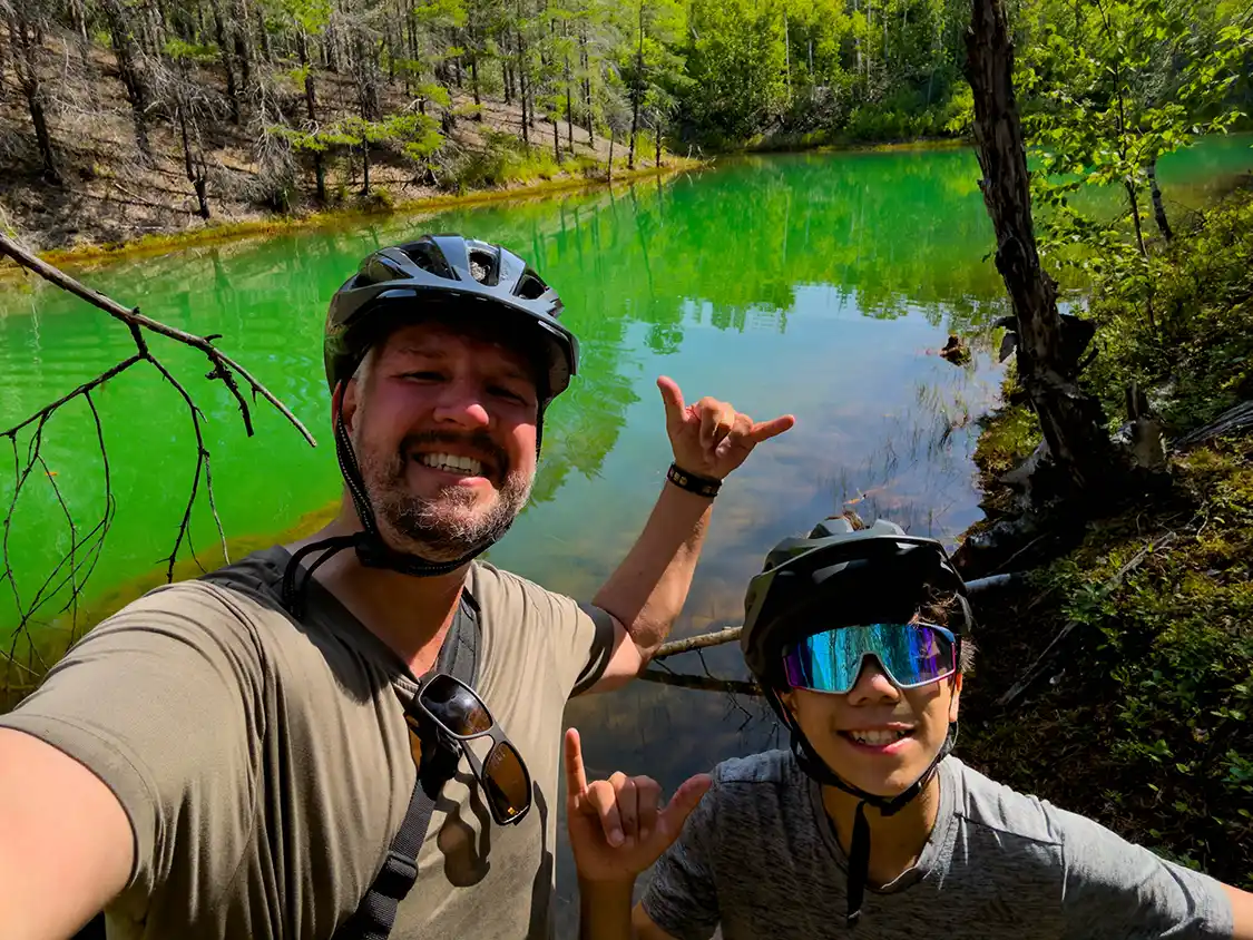 Kevin Wagar and his son mountain biking in Minto New Brunswick
