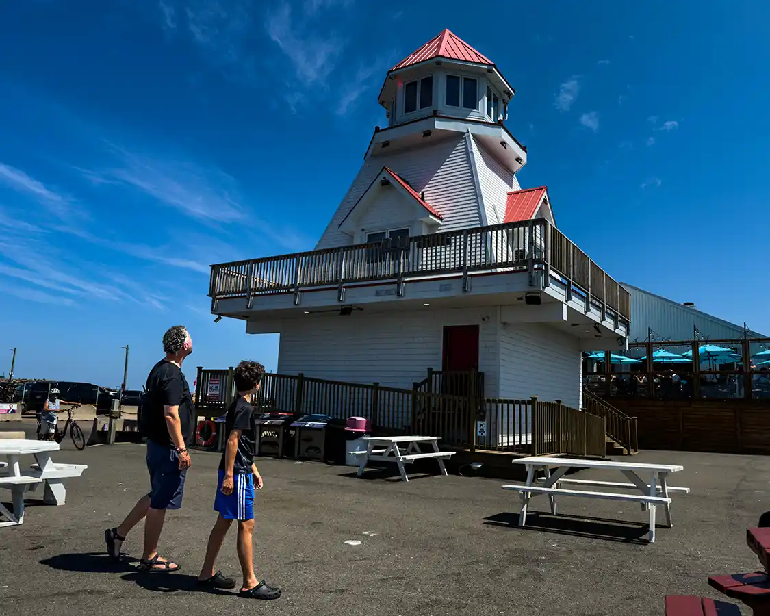 Kevin Wagar waslk the Shediac Pointe du Chene Wharf with his son
