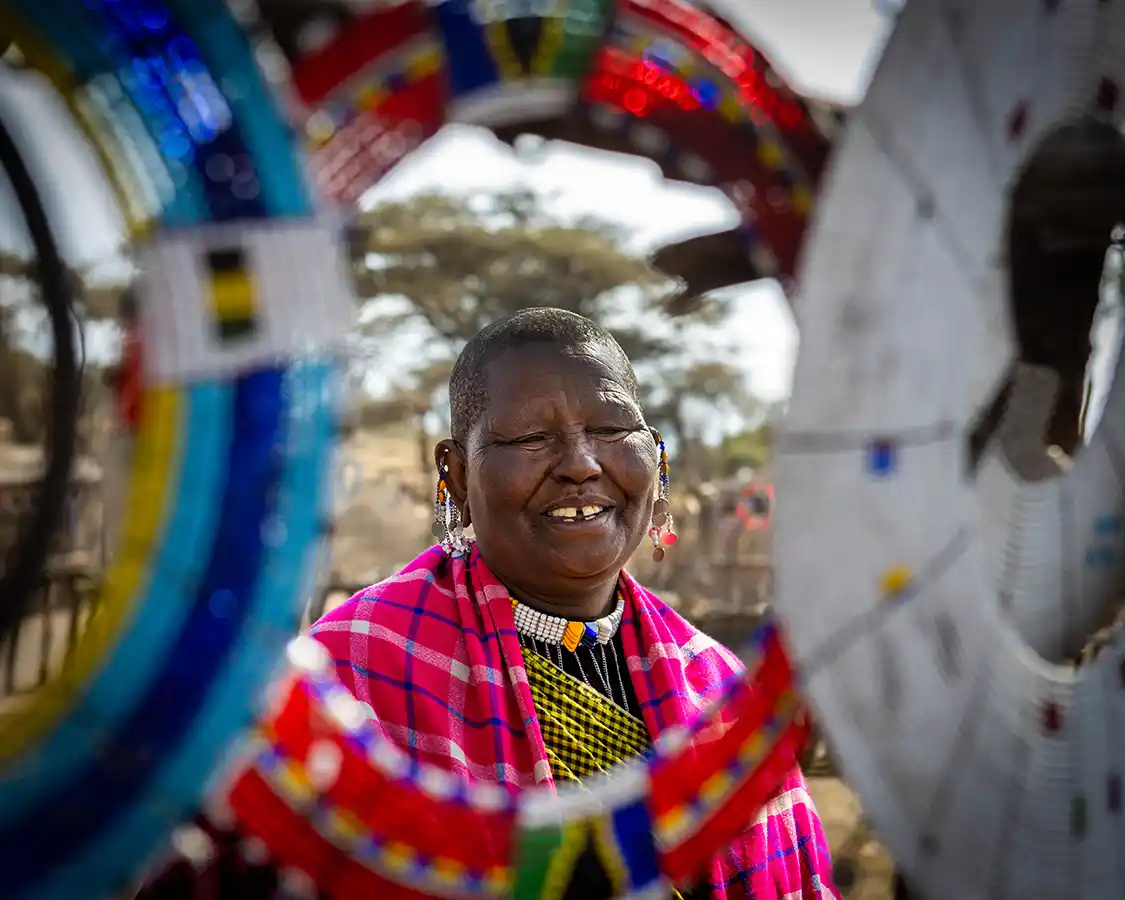 Maasai woman framed by a beaded neck decoration