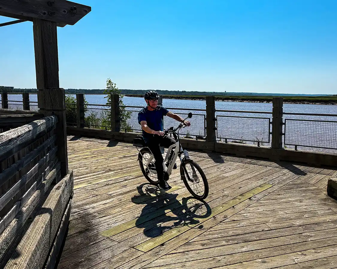 Man cycling the Moncton riverwalk