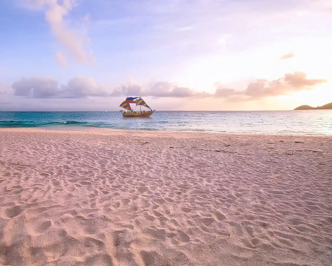 Balangay sailing past Puka Beach Boracay