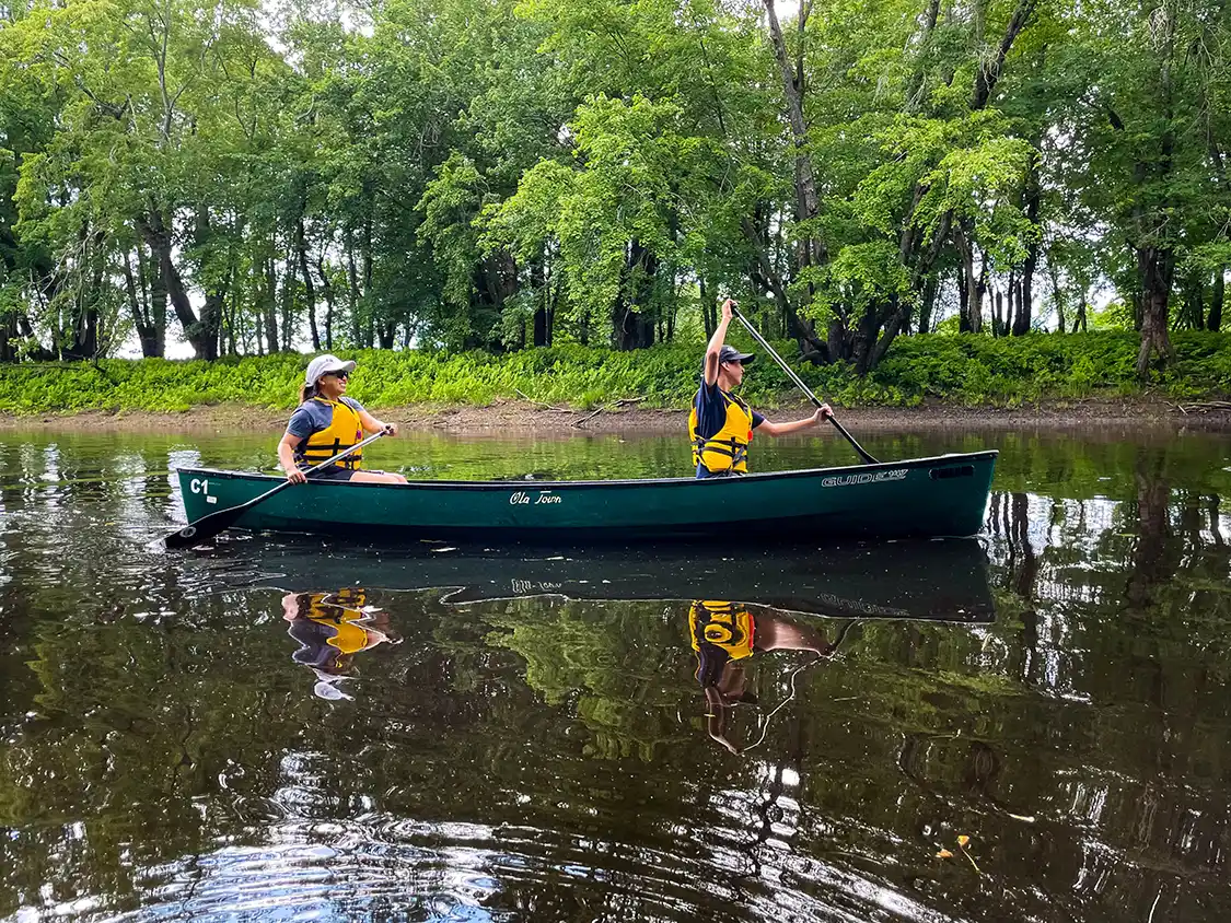 Christina and Cohen paddle the Nashwaak River
