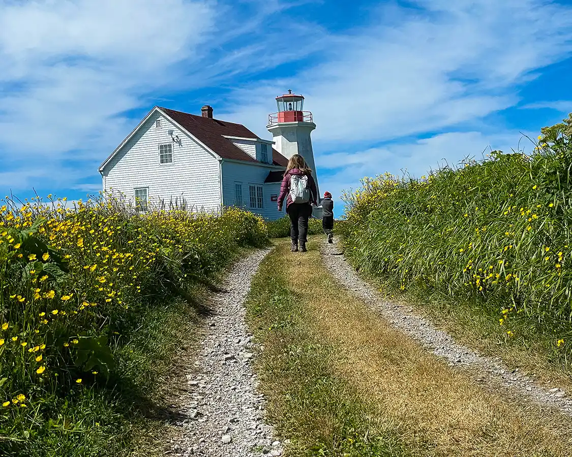 Christina and Cohen Wagar hike to the lighthouse on Ile Peroquettes