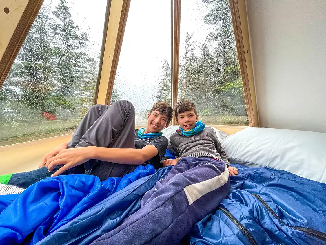 Two boys camping in a Parks Canada Oasis pod on Grande Ile in Mingan Archipelago National Park Reserve