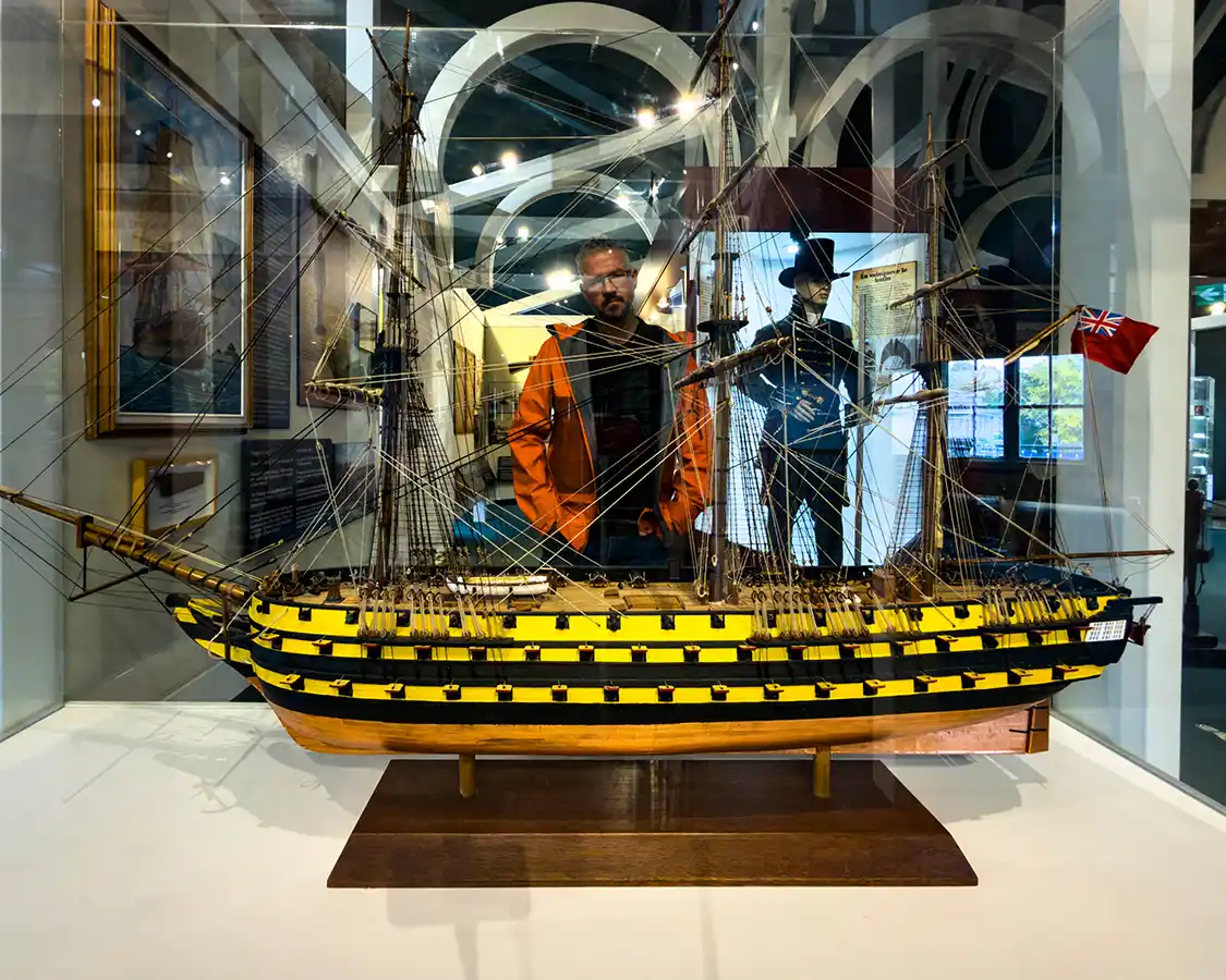 Kevin WAgar looks at a model boat at the 1000 Islands History Museum