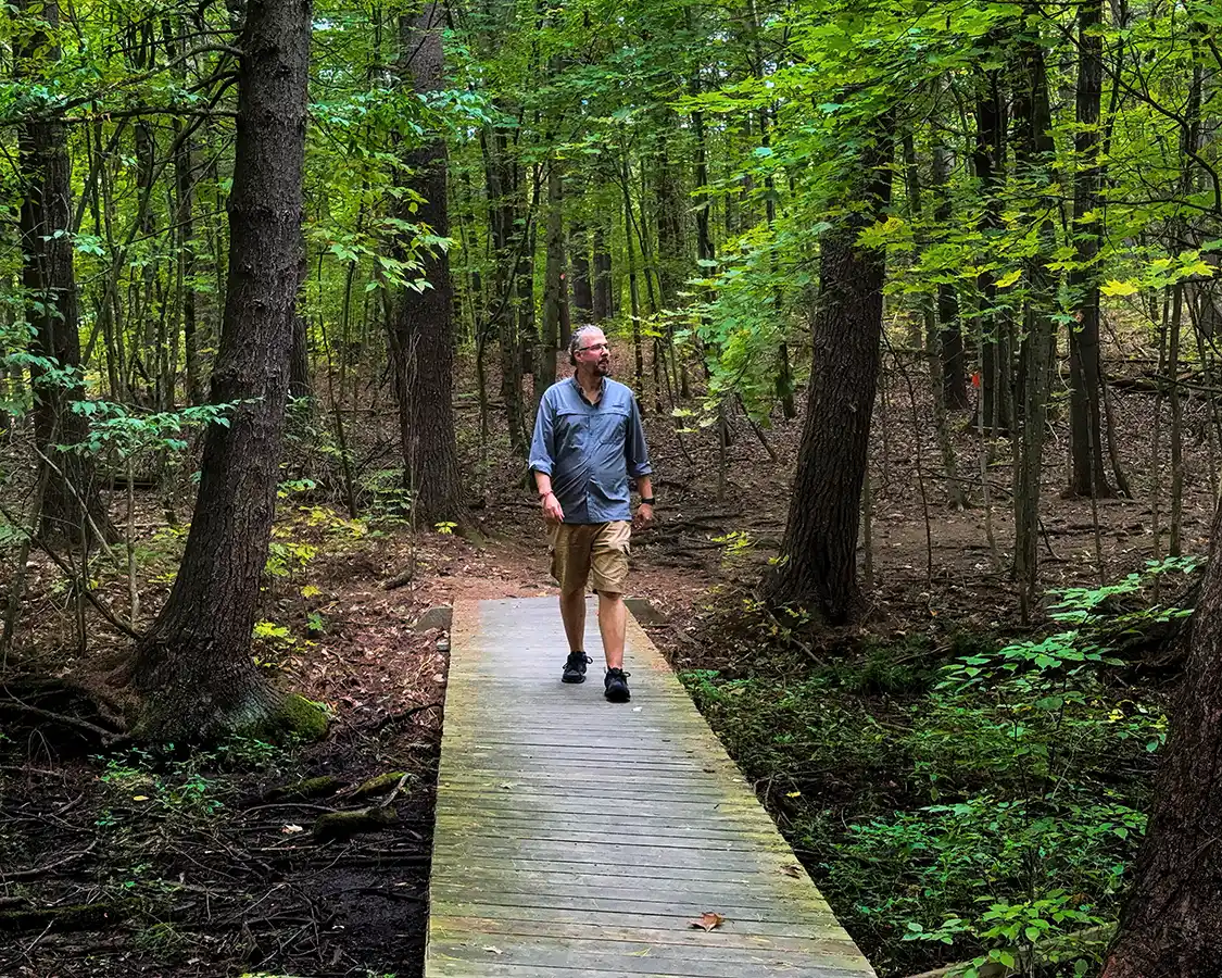 Kevin Wagar hikes a boardwalk of the Jones Trail in Thousand Islands National Park